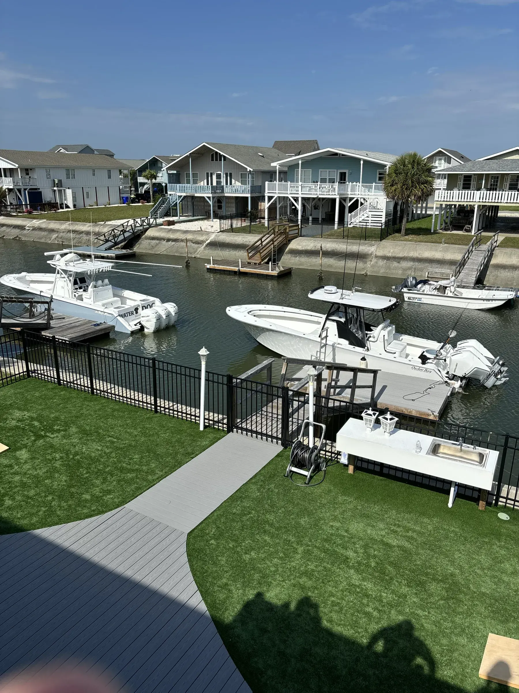 A waterfront home's dock and floating platform on a coastal North Carolina canal